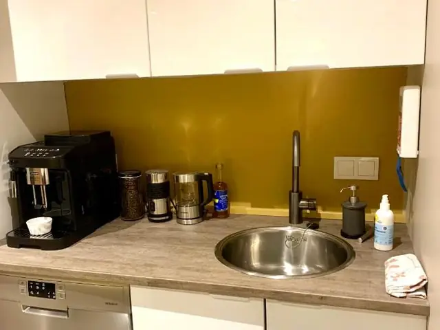 Kitchen corner with a coffee machine and sink at NN Urban Guesthouse